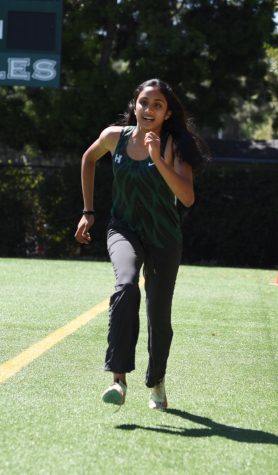 Anjali Yella (11) sprints forward in preperation for a long jump. Anjali played basketball and ran track last year, using skills from each sport to improve the other. 
