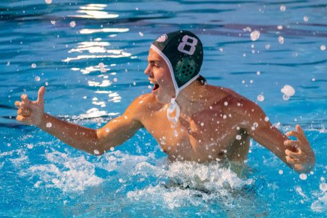 Senior Indigo Lee hypes up his teammates before the start of the fourth quarter. The varsity boys water polo team secured a 21-9 home game win over Skyline on Sept. 2.