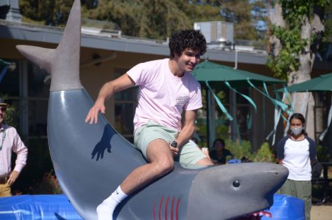 Jai Vir Mehta (12) rides on the mechanical shark, one of the main attractions at Fridays Spirit Kickoff. Harker Spirit Leadership Team hosted the kickoff, themed Spirit of Summer, on Friday afternoon.