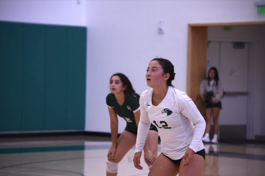 Junior varsity girls volleyball libero Aline Grinespan (9) waits for the ball during their game on Thursday. The Eagles defeated Pinewood in two sets, starting their league record at 1-0.