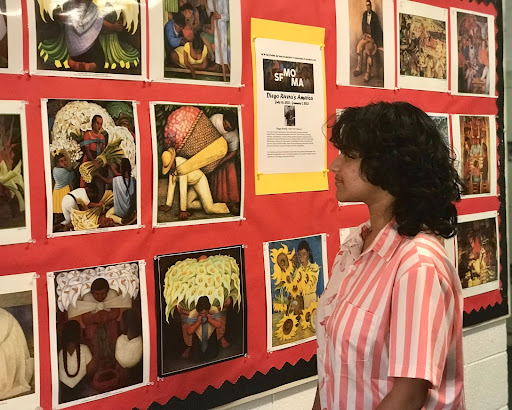 Fern Biswas (10) admires the Diego Rivera bulletin board in Main Hall, which features over 150 paintings about Rivera’s dream of what North America would be like. Hispanic Heritage Month began on Sept. 15 and honors different types of Hispanic culture in the world. 