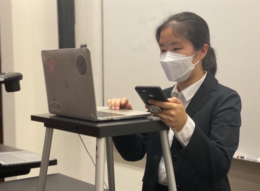 Sahngwie Yim (10) practices speed reading at the  National Speech and Debate opener in Lexington, Kentucky last weekend. Ten upper school students participated in the tournament, with several receiving top awards and bids. 