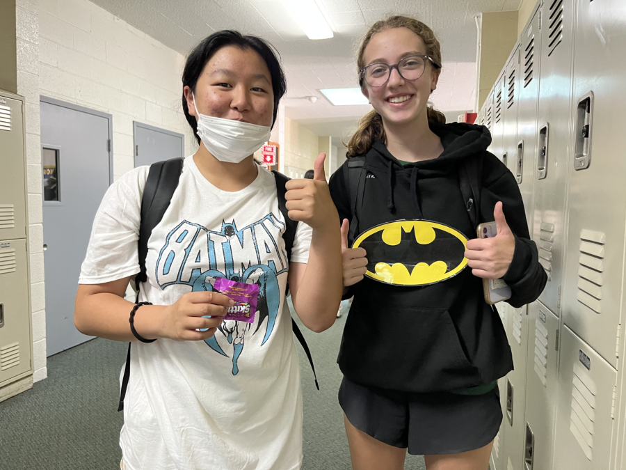Two sophomores pose in Batman-releated tops, for their theme of Justice League. The sophomore and juniors dressed up in their class theme today, and the frosh and seniors will do the same on Wednesday. 
