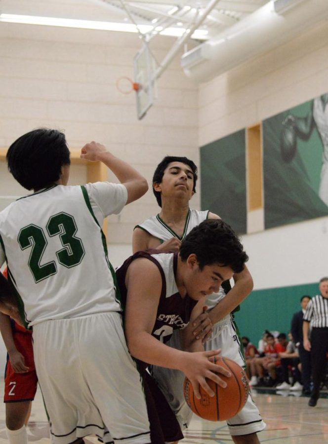 Ritik Raman (9) grapples with a Stratford player. The Eagles defeated them 45-18 in their season opener.