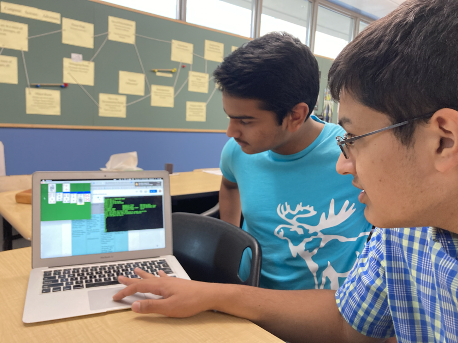 Aarav Borthakur (10) and Tanay Sharma (12)  review the Solitaire lab from the AP Computer Science with Data Structures classes. The students completed the lab to better understand the implementation of the stack data structure. 