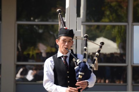 Rupert Chen (12) plays the bagpipes during Quadchella on Oct. 19. The bagpipe is a traditional Scottish instrument that is part of the woodwind family.