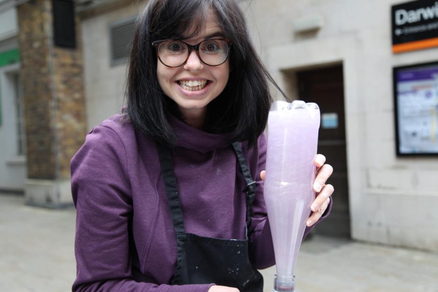 Physicist and research fellow Dr. Jess Wade poses with a bottle of non-Newtonian fluid. Dr. Wade has written over 1,750 articles about women in STEM online.