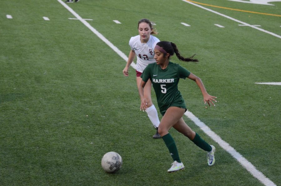 Anya+Chauhan+%2811%29+races+to+gain+possession+of+the+ball.+The+varsity+girls+soccer+teams+overall+record+stands+at+2-0.