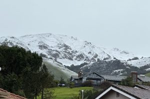 Snow lays on the mountains of Mission Peak in Fremont yesterday. A historic California winter storm brought snow and hail to the Santa Cruz Mountains starting Thursday, closing Highway 17 and preventing up to 104 students and faculty from attending school yesterday. 