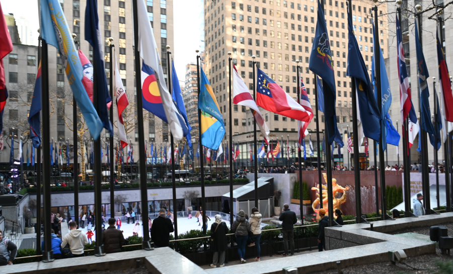 A row of vibrantly colored country flags sway with the wind, above the outdoor skating rink and famous golden statue of Prometheus in New York City's Rockefeller Center. Upper school journalism staff visited Rockefeller Center on Thursday, exploring its various shops, restaurants and monuments. 