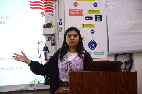 Model UN Director General Sasha Masson (11) presents the details of the NHSMUN Conference in New York during a club meeting on March 3. Delegates left for the conference on March 8 and competed on March 10.