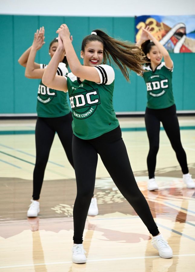 Members of Harker Dance Company clap their hands together in their routine. They performed an upbeat hip hop themed dance to “Trumpets” by Sak Noel and Salvi ft. Sean Paul.