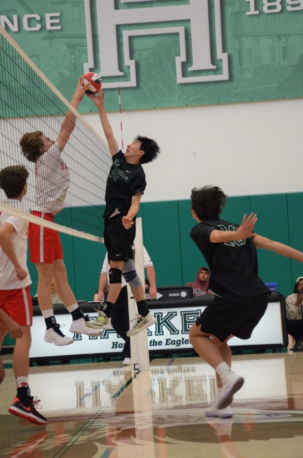 Adrian+Liu+%2811%29+reaches+up+to+save+the+ball+from+going+over+the+net+during+the+quarter+finals+match+against+Saratoga+High+School+on+May+9.+The+varsity+boys+volleyball+team+won+their+match+against+Saratoga+in+three+sets%2C+25-17%2C+25-16%2C+25-22.