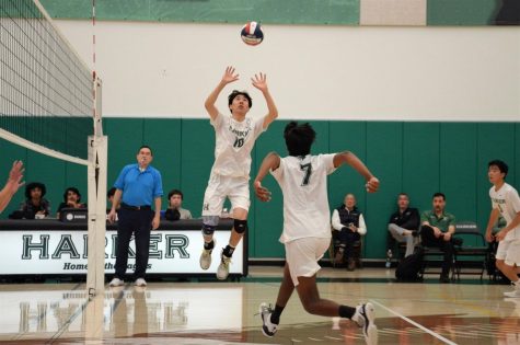 Adrian Liu (11) sets Rahul Yalla (10), earning a kill against Harbor High school in their match on May 11. Adrians favorite play of the game was his attack on the second contact at the end of the third set.