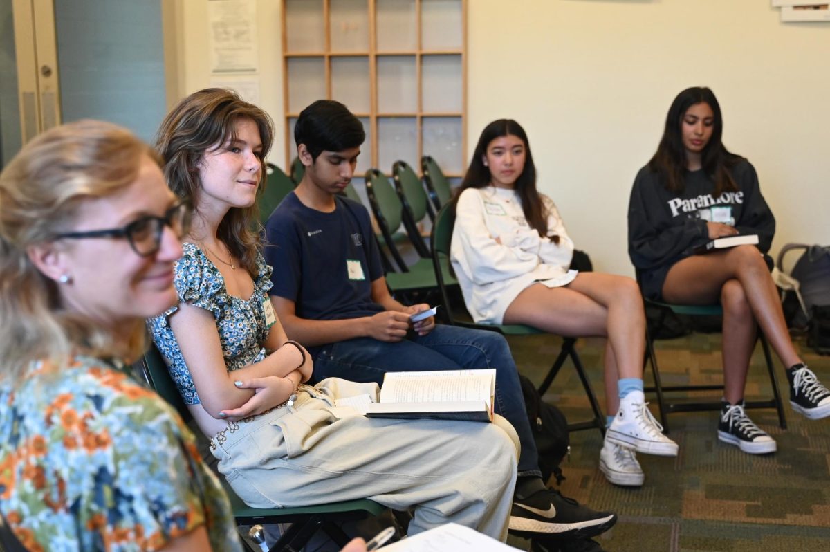 Upper school librarian Meredith Cranston and students listen to author Parini Shroff introduce her novel Bandit Queens and share her favorite aspects of the book. Shroff was one of the two visiting authors who attended Recreate Reading.
