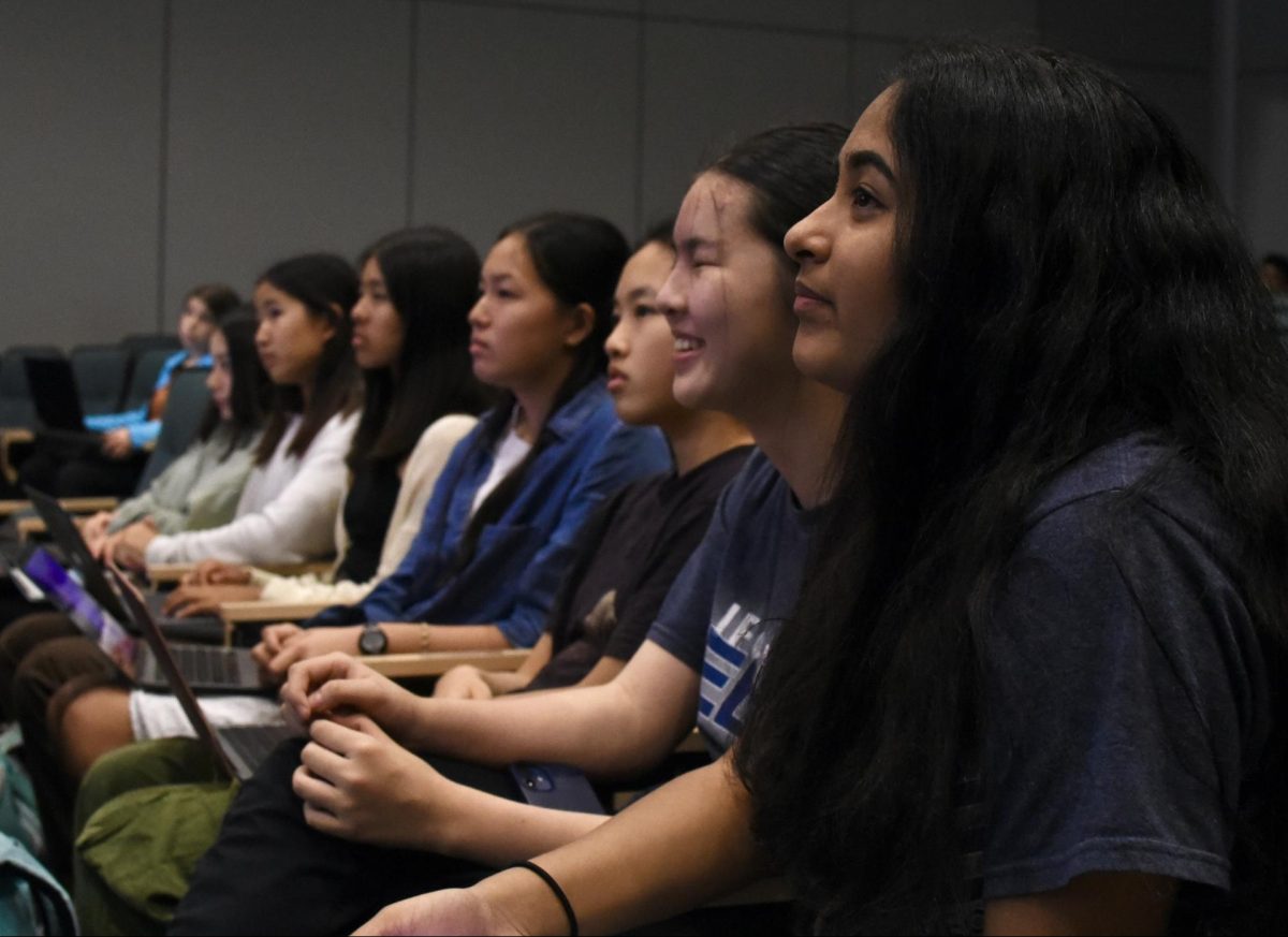 Audience members listen attentively to upper school science department head Anita Chetty during the non-RRI portion of the upper schools annual Synopsys information meeting. Chetty went over Harkers project selection guidelines as well as key dates.