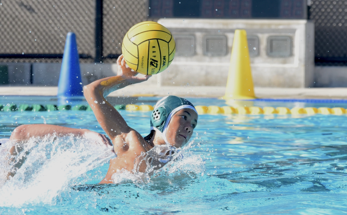 David+Kelly+%289%29+lifts+his+arm+in+preparation+to+pass+the+ball.+The+junior+varsity+boys+water+polo+team+defeated+Fremont+High+School+12-3+at+home+on+Thursday.