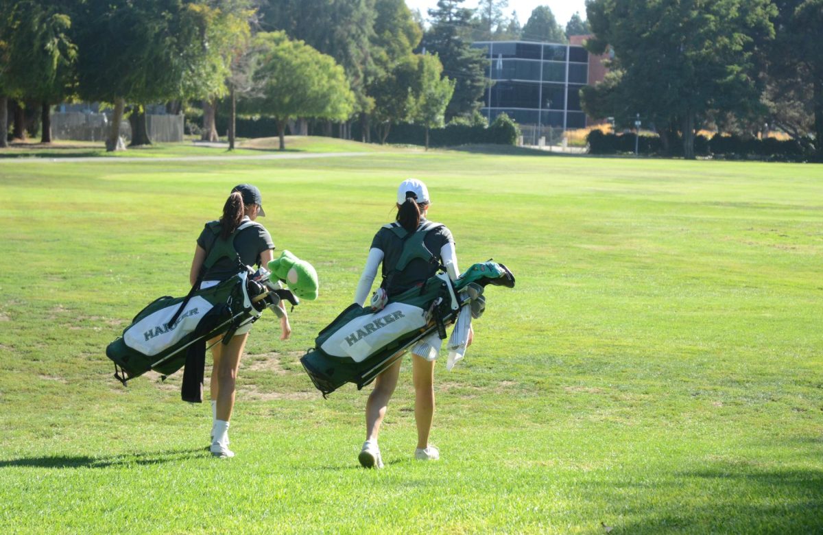 Juniors Khanhlinh Tran and Allison Yang walk together on the first hole of Sunnyvale Golf Course. The two were the first to tee off at around 4 pm.