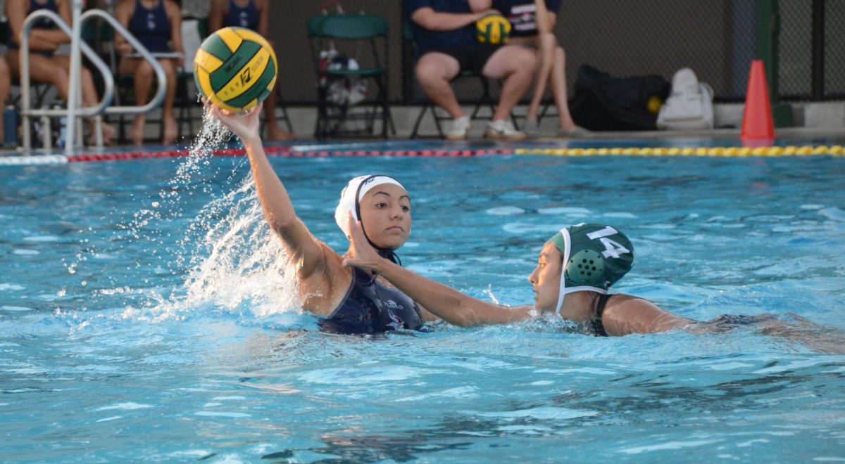 Co-captain Keren Eisenberg (11) attempts to block a Lynbrook player. The team currently holds a 3-0 overall record and is ranked #1 in the league standings.