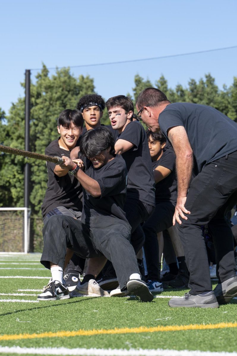 Seniors Reza Jalil, Jack Yang, Kai Stinson and Luke Mehta compete for the class of 2024 in their tug-of-war match against the sophomores. “I think that were the best class, and we have to represent that especially at Homecoming, when all the campuses are there, Reza said.
