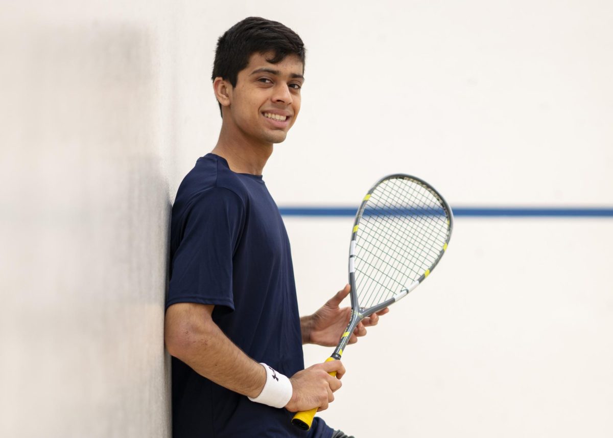 Varun Fuloria (12) poses with a squash racket. Varun will continue his squash career at Columbia University in the fall of 2024. 
