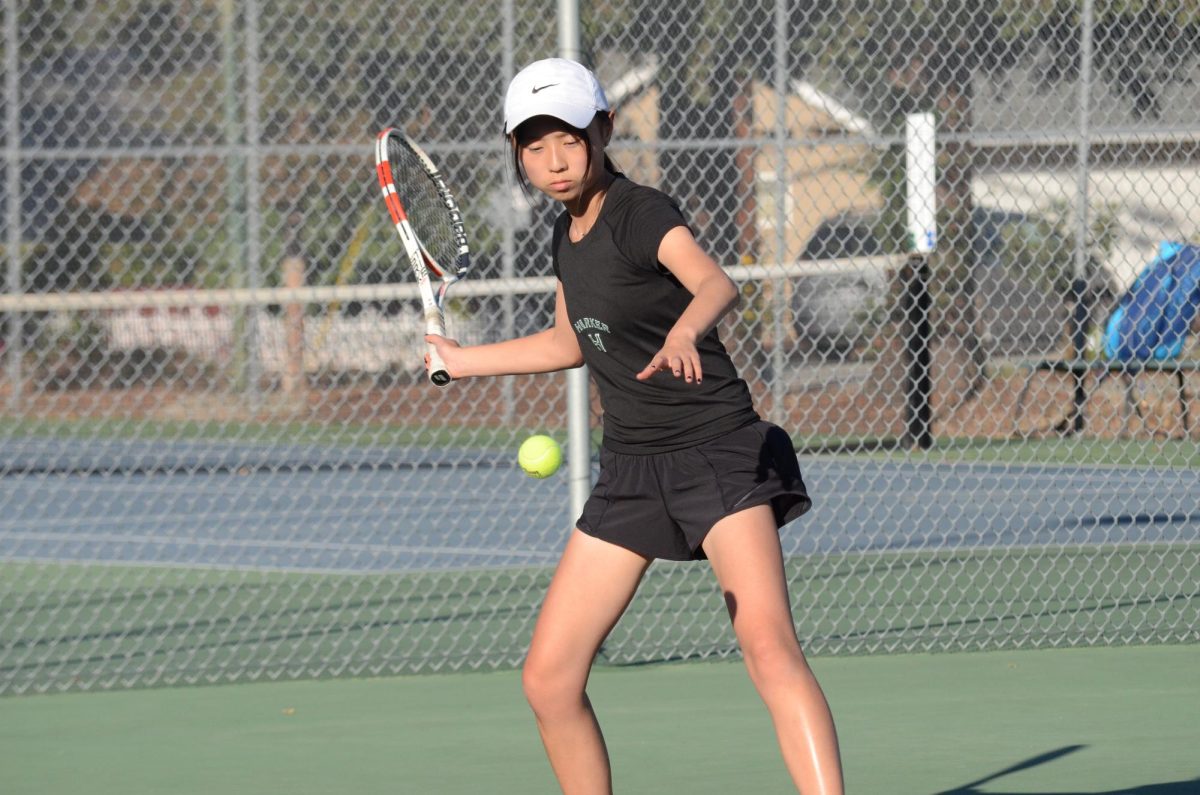 Elaine Zou (9) serves the ball during the first set. Elaine lost both sets 1-6, 3-6, playing at the fourth singles spot. 
