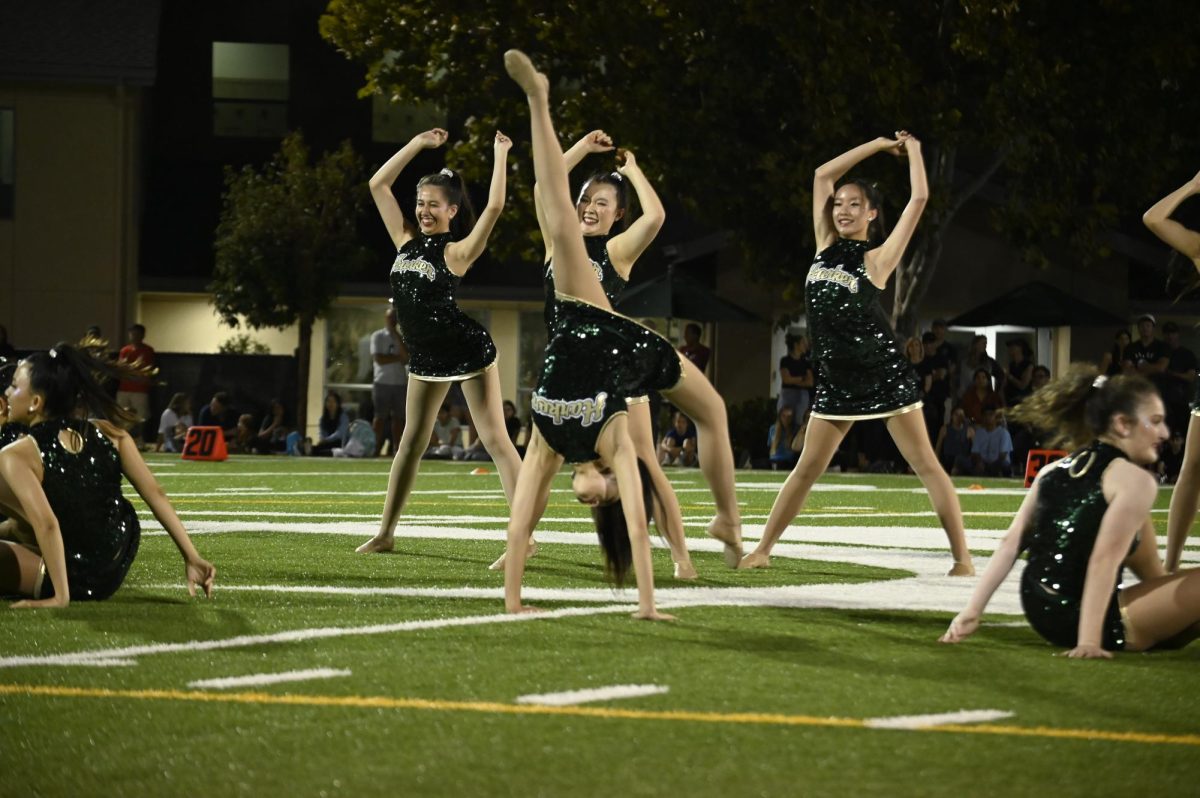 Anna Lee (12) completes a back walkover during Harker Dance Companys routine.
