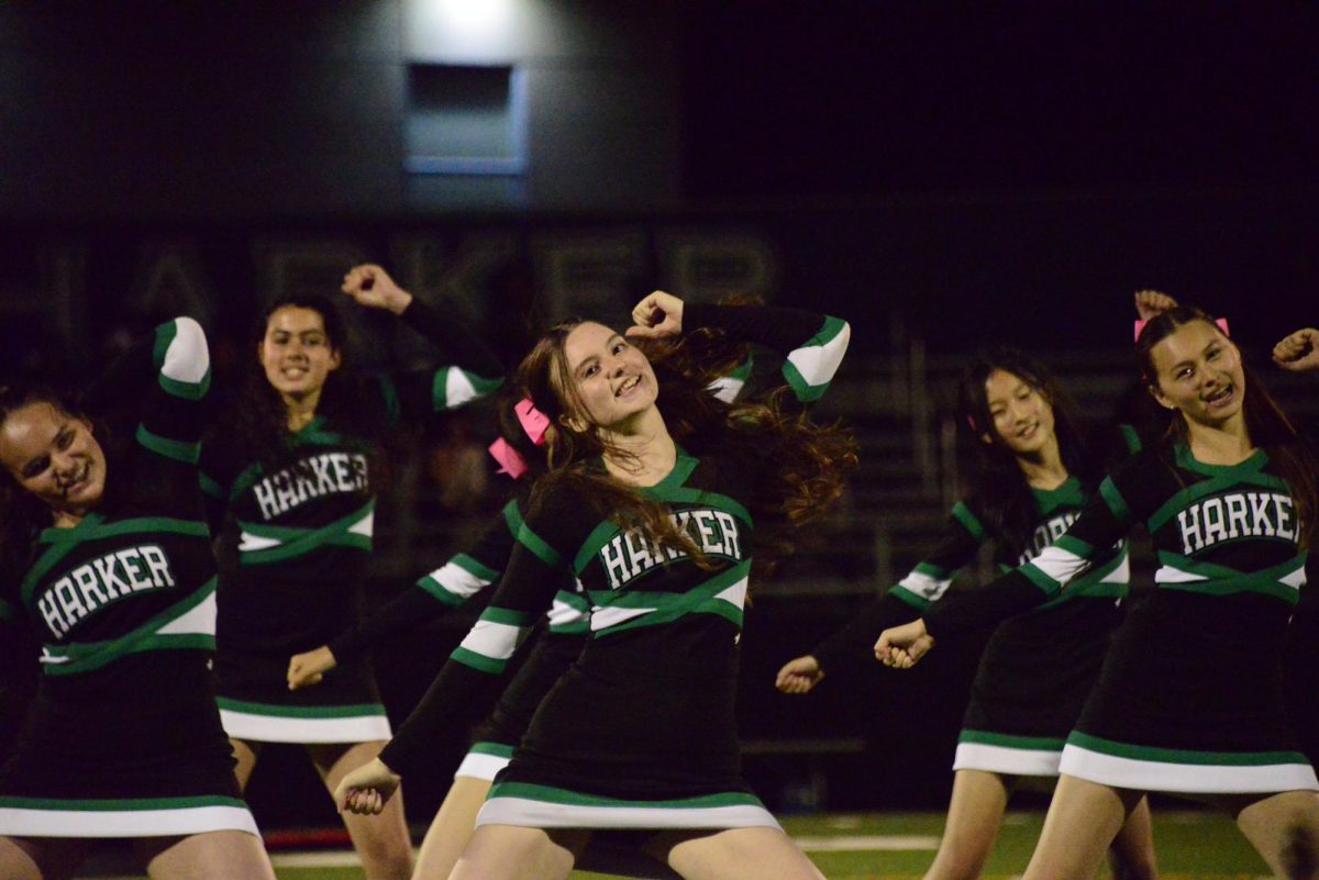 Cheerleaders perform a dance routine during a football home game against Branson. The team attends all the football games to encourage support for the football players.