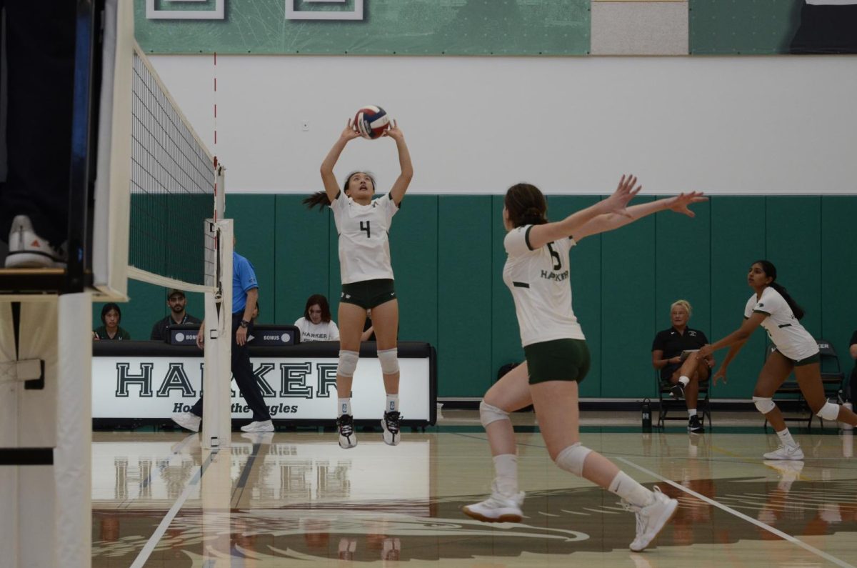 Setter Keira Chang (10) sets the ball to middle blocker Emily Mitnick (11) as she sets up to swing. The Eagles defeated Eastside in three straight sets.