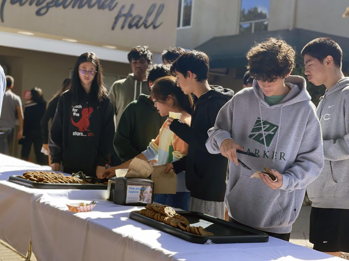 Students line up to get cookies outside of Manzanita Hall on Tuesday. In celebration of former Harker president Howard Nichols birthday, students and faculty enjoyed chocolate chip cookies, one of Nichols favorite desserts.