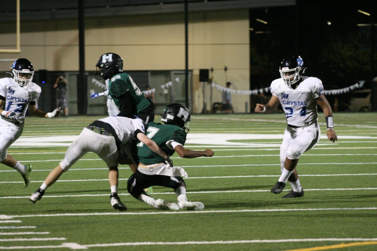 A Gryphon takes down Rayan Arya (11). Rayan is one of the Eagles quarterbacks.