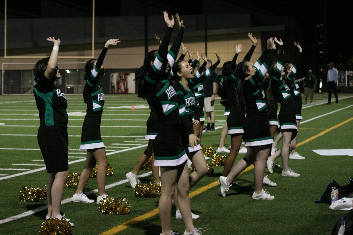 The Harker cheerleading team chants during the game. The team often encourages the audience to chant with them during plays.