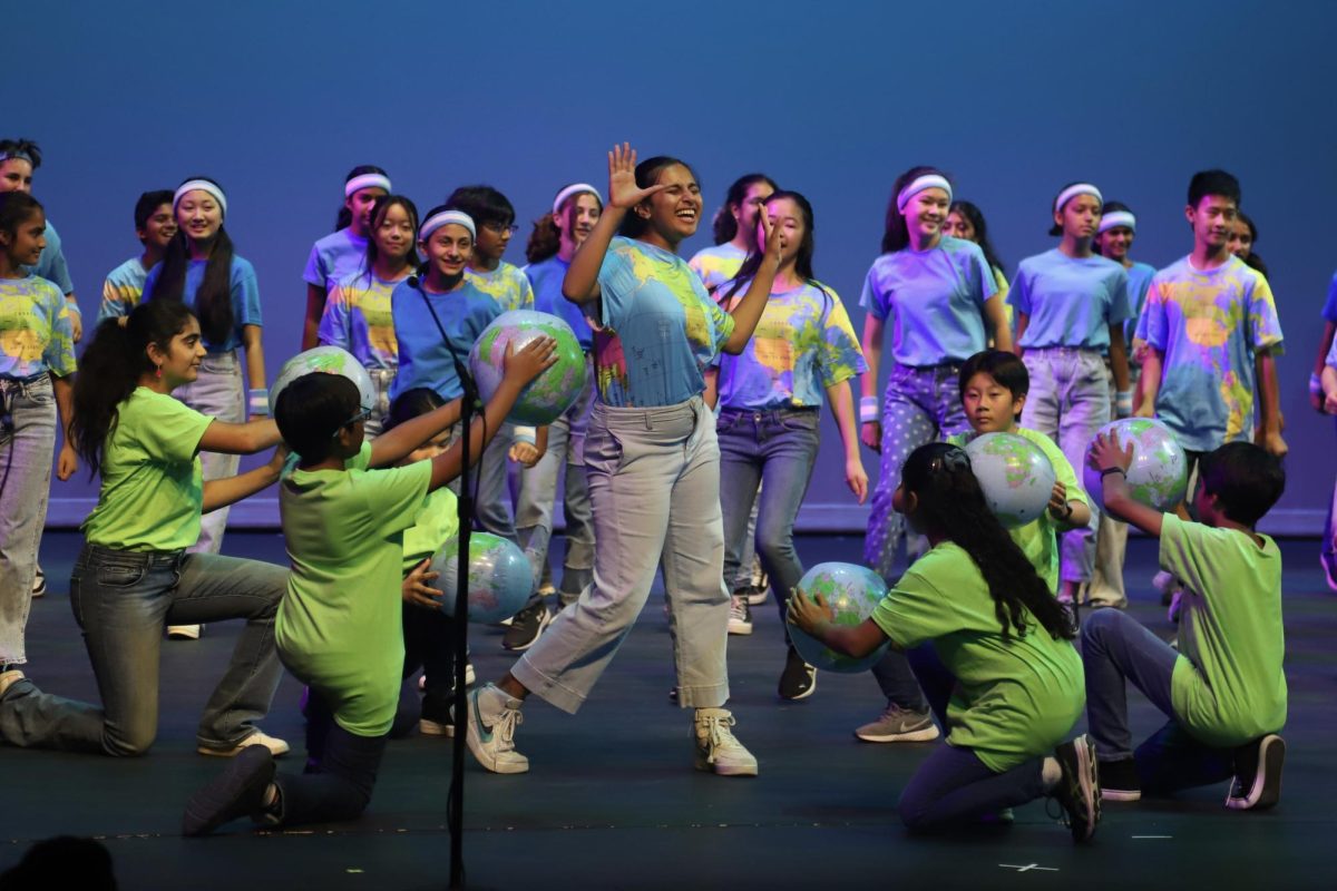 The middle school combined choir performs during the Harker Day production on Oct. 7 at 1:30 p.m. The sang “All Over the World” from the 1980 film “Xanadu.”