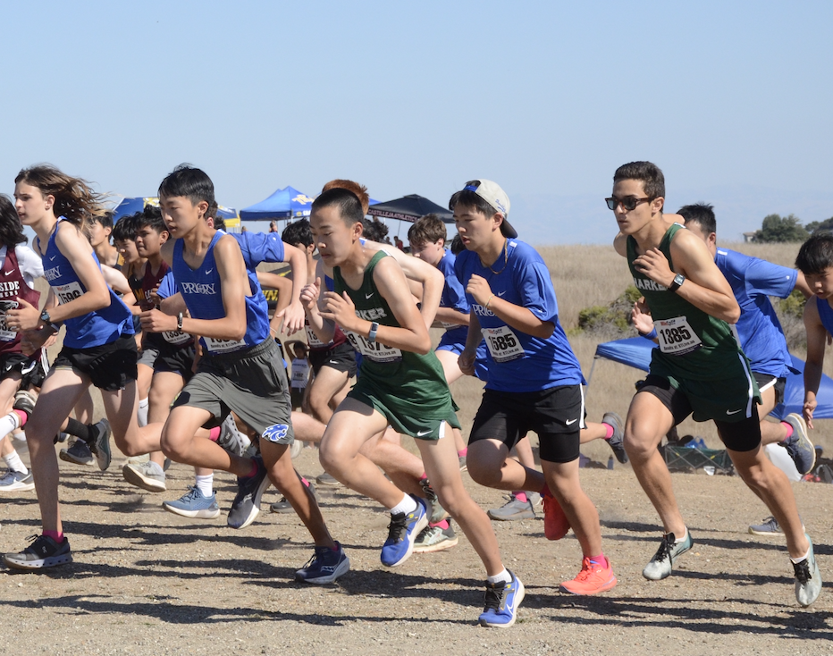 Jonathan Li (9) and Adam Sayed (12) bolt past the starting line of the boys JV race. Out of 120 total runners, the pair finished 20th and 26th with times of 20:35 and 21:13, respectively.