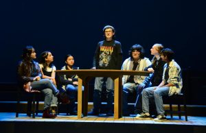 Sergeant Hing, portrayed by Thomas Campisi (10), gives a monologue to to other members of the Tectonic Theater Project in this years fall play The Laramie Project. The production performed in three shows and presented the murder of gay student Matthew Shepard and its aftermath.