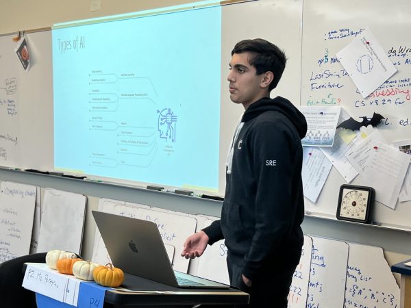 Krish Arora (10) delivers a presentation on AI hyperparameters during an AI Club meeting on Nov 10. AI Club hoped to make the discussed concepts accessible to their audience.