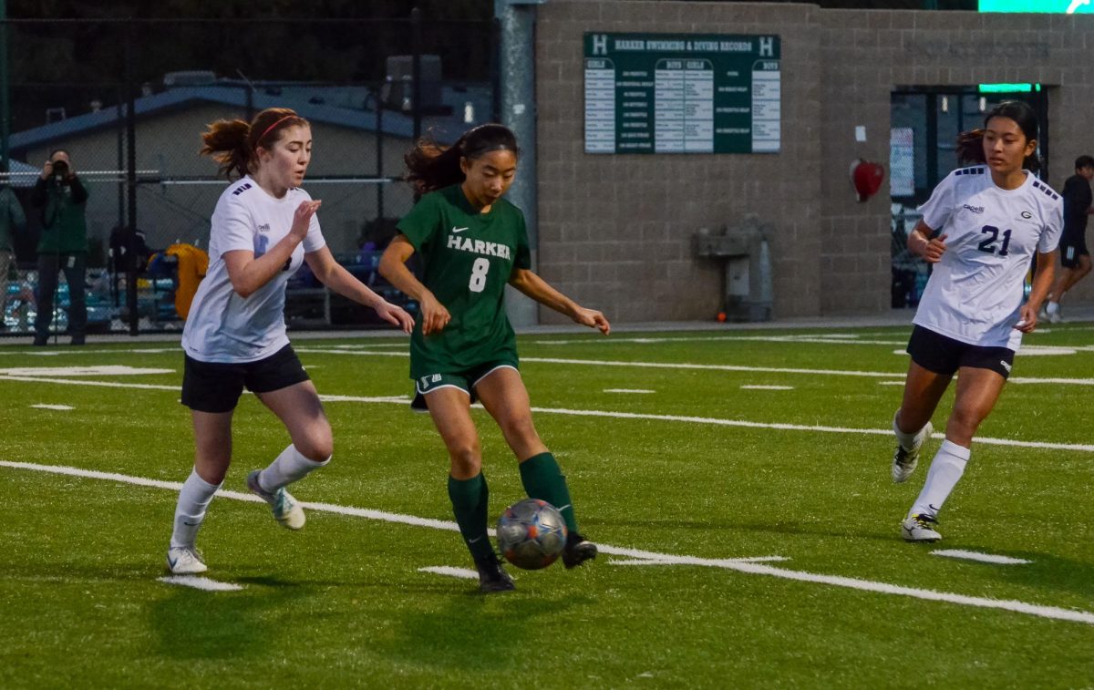 Eva Cheng (10) navigates through Gunns defense, finding an opening to make a pass to her teammate. The varsity girls soccer team travels to Westmont High School next.