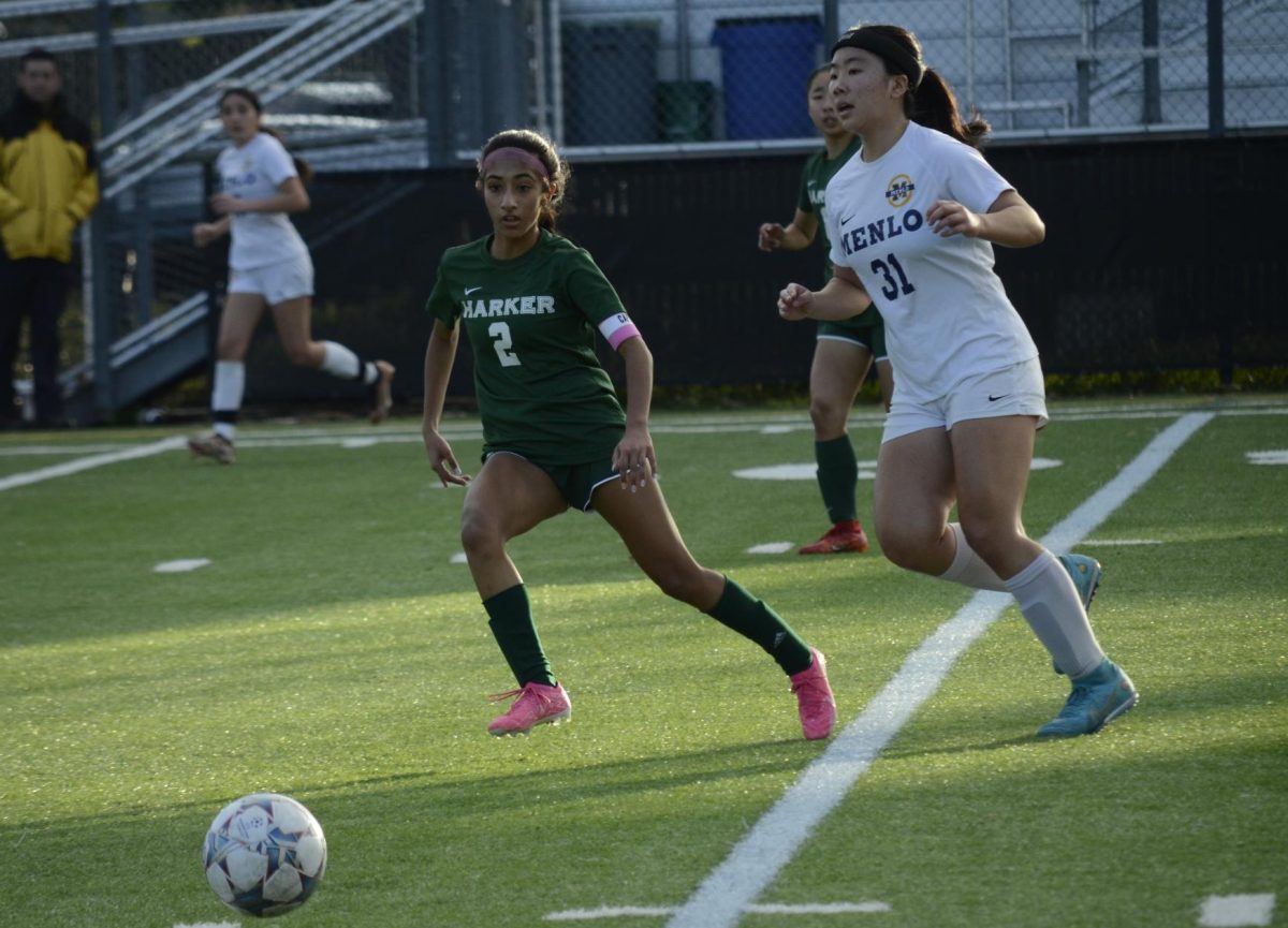 Co-captain Anya Chauhan (12) receives a pass. This was the teams first game of the WBAL.