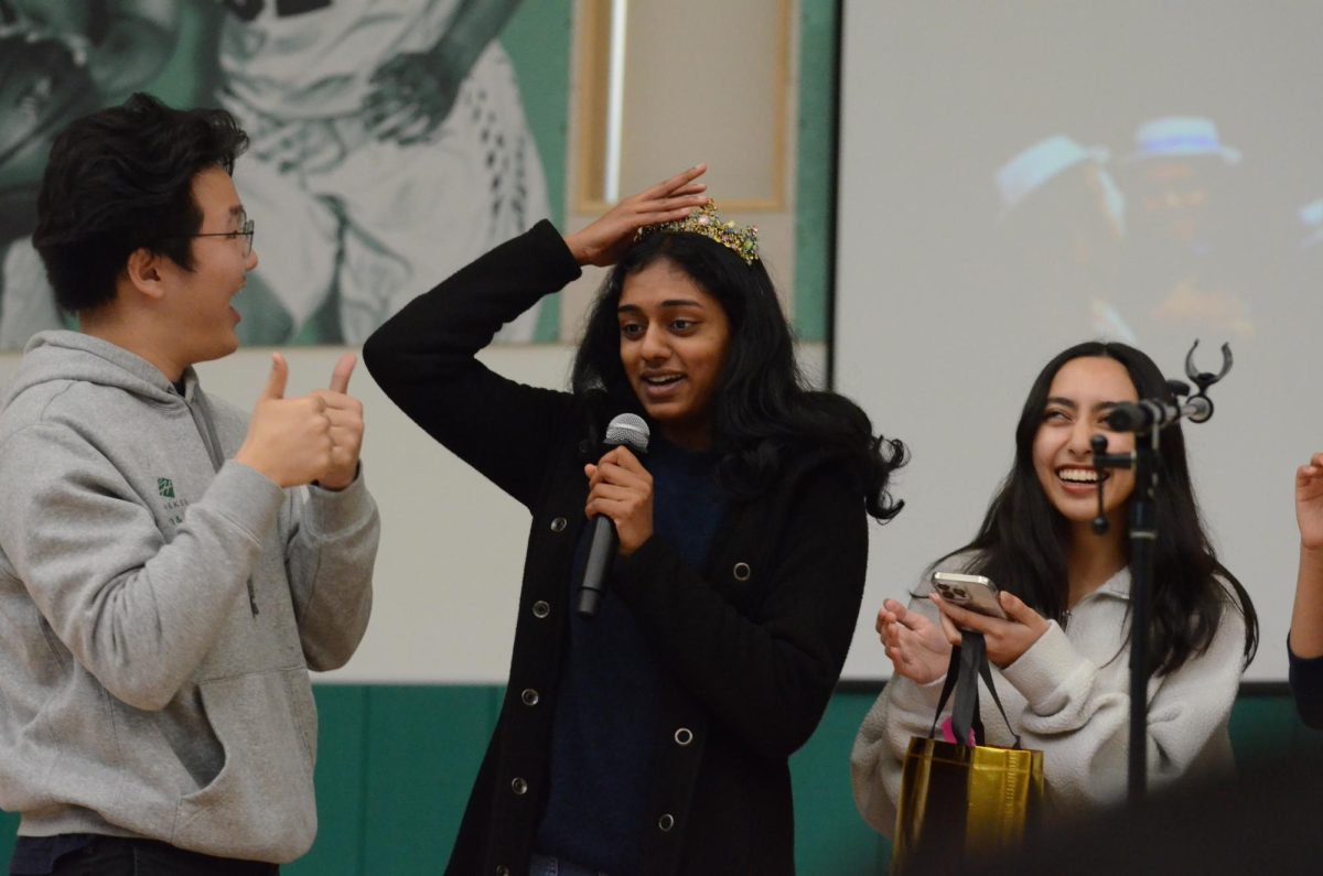 Harker Conservatory representatives present Conservatory Student of the Month Cantilena singer Juhi Madala (12) with a crown. Conservatory representatives also invited everyone to attend the 2024 Dance Production.