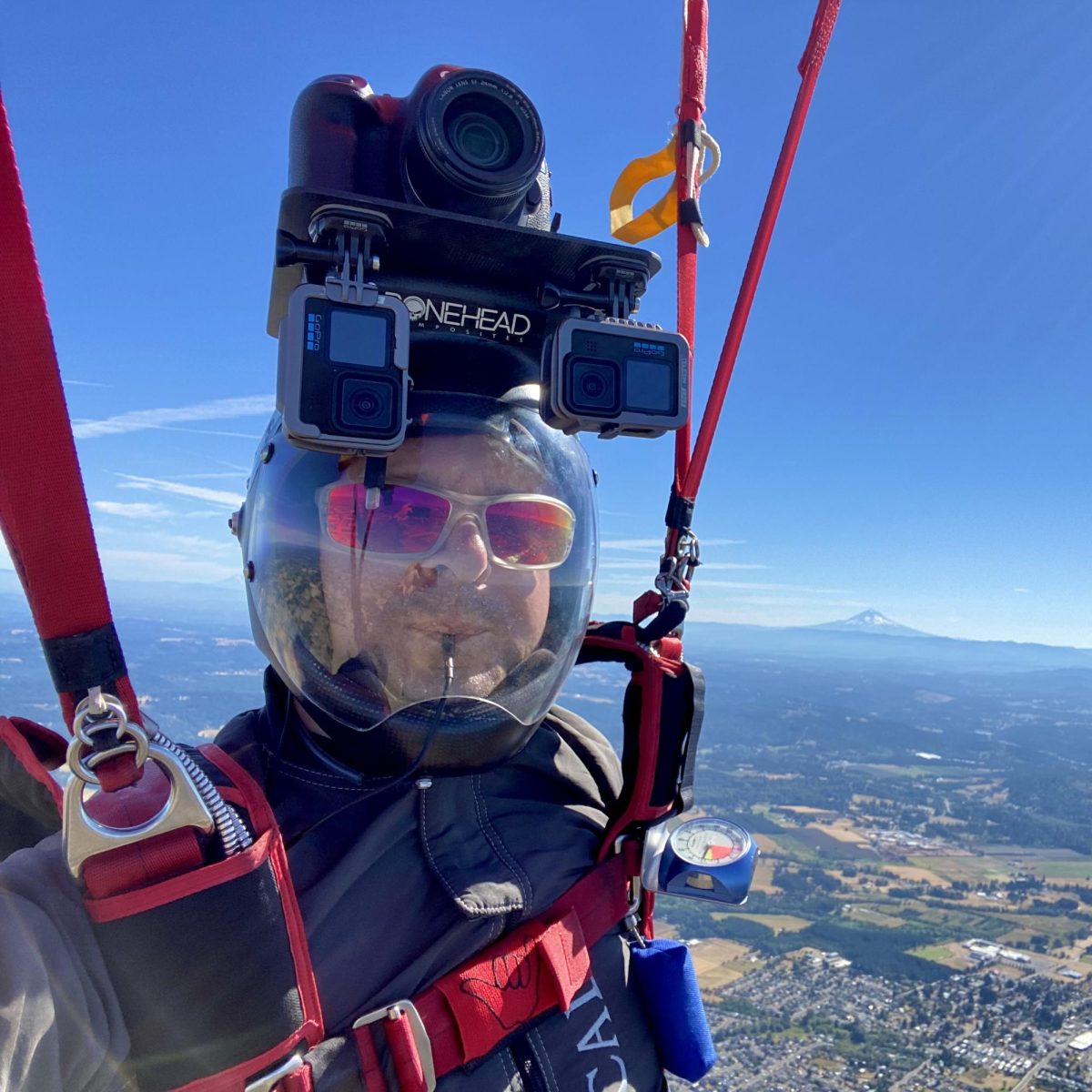 Marc Leglise (’03) snaps a selfie from the air using a camera-helmet system. His passion for skydiving connects him to his work at Columbia Sportswear, where as a senior manager of e-commerce technology, he helps people secure the gear he uses in the air.