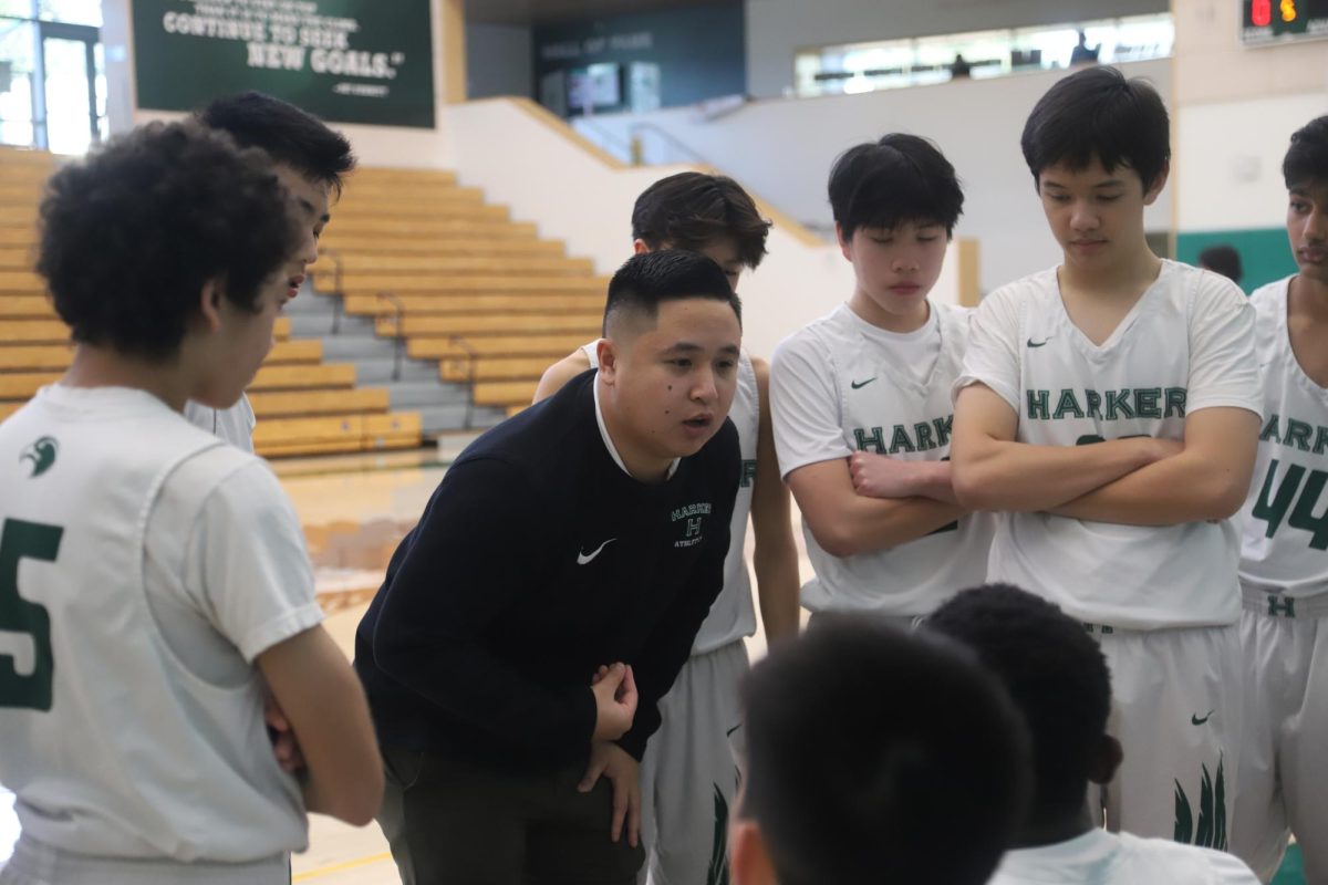 Nick Nguyen coaches the junior varsity boys basketball players at the end of the first quarter against Menlo on Feb. 2. “I'm at the point where I just want to see my guys do well,” Nguyen said. “I want to teach them all the knowledge that I have and my passion for basketball and be able to pass that on.” 