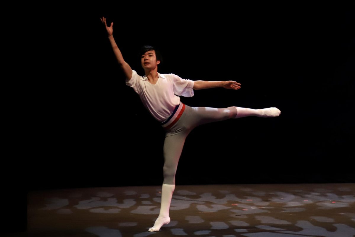 Junior Anwen Hao holds an arabesque during his performance of a ballet variation to “Flames of Paris.” This years Hoscars was the third production Anwen has danced in.