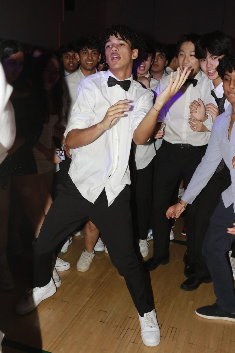 Kai Stinson (12) dances to Teach Me How to Dougie by Cali Swag District during Winter Ball on Jan. 20. The dance was themed to Old Hollywood this year.