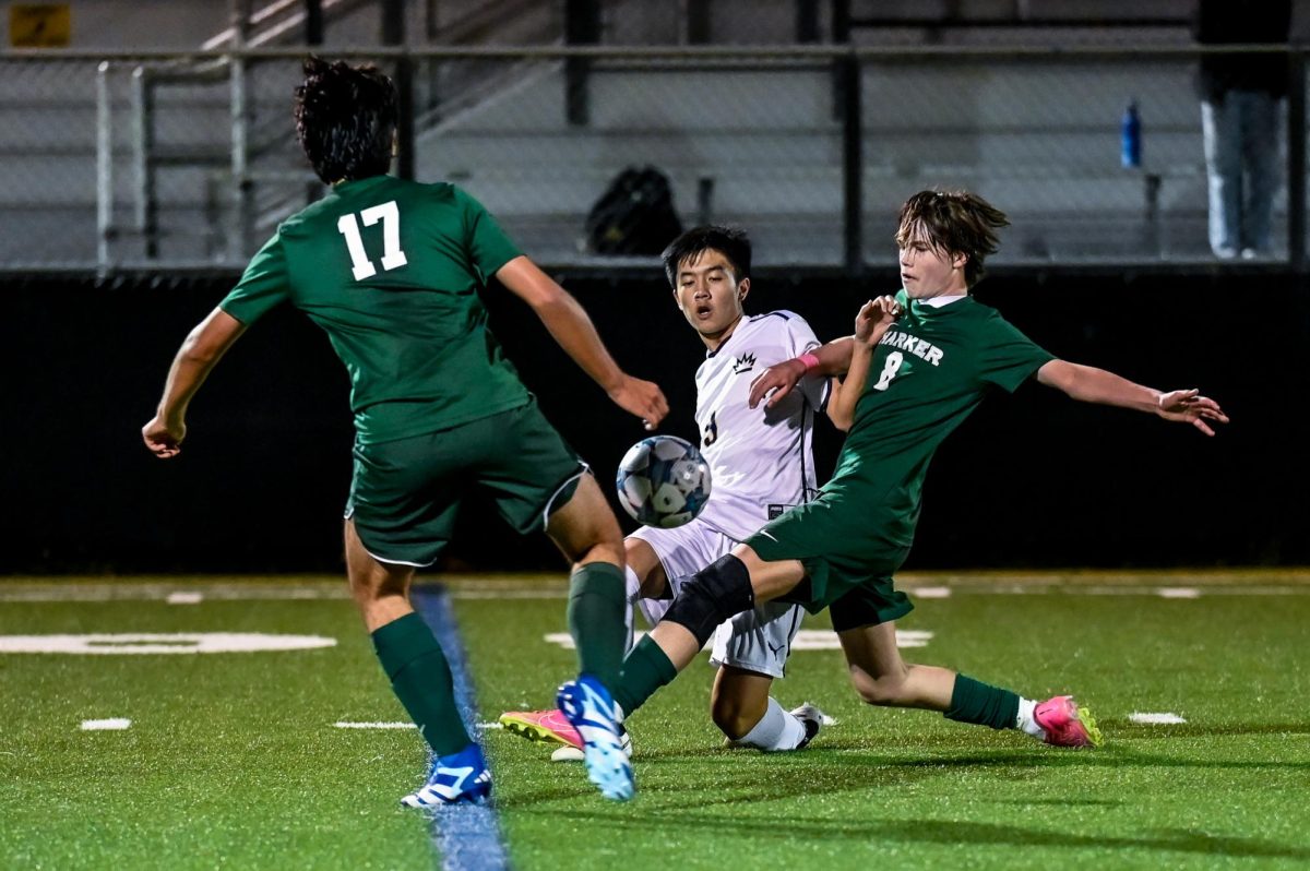 Forward Ryder Hewitt (10) and co-captain Ben Cha (12) steal the ball from a Lion. The team faced King’s Academy at their annual Kicks Against Cancer game. 