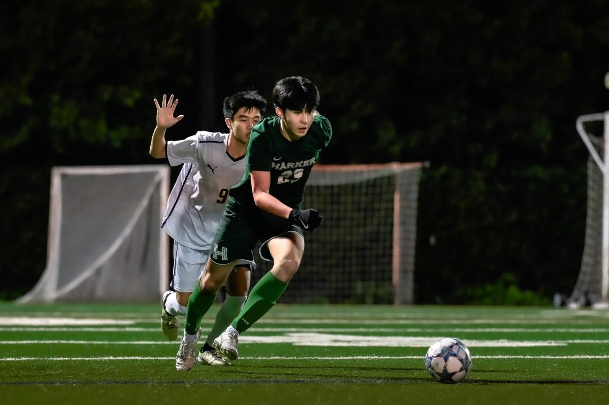 Forward Alec Zhang (11) charges towards to ball. The varsity boys soccer team tied with King’s Academy 2-2.