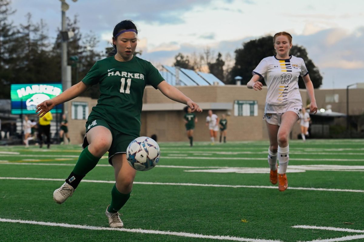 Defender Audrey Yang (11) dribbles the ball. Former varsity soccer player Ashley Barth (’22) helped lead Kicks Against Cancer events during her time on the team. 