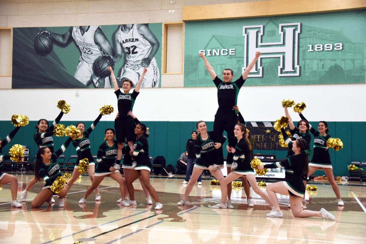 The cheer team executes two thigh stands to close their halftime performance. They highlighted senior teammates James Blenko and Owen White. 