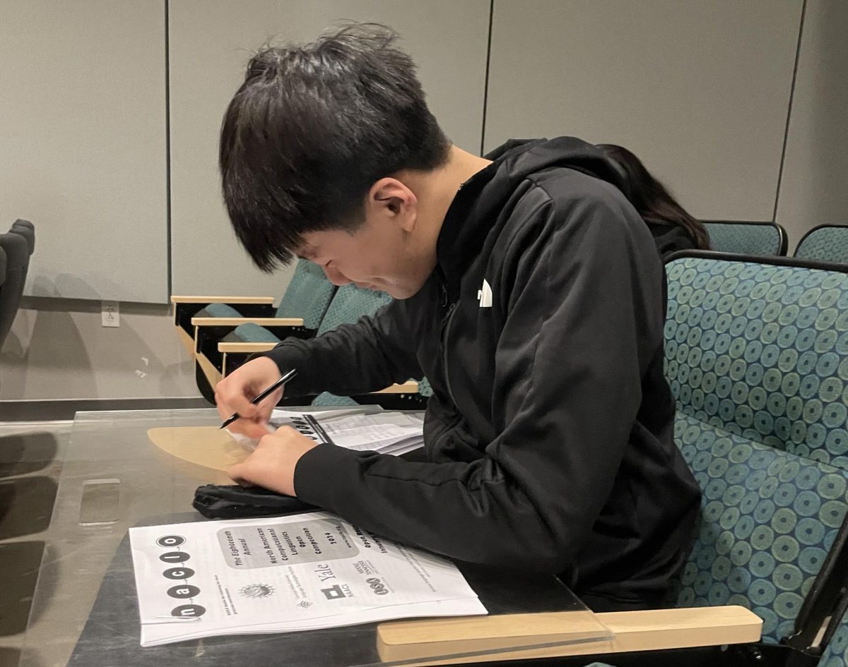 Samuel Tong (10) fills out his answer form for the 2024 NACLO competition in Nichols Auditorium on Jan. 25. “It was a fun experience even though the questions were a little challenging, and I got the opportunity to do some critical thinking, Samuel said. 