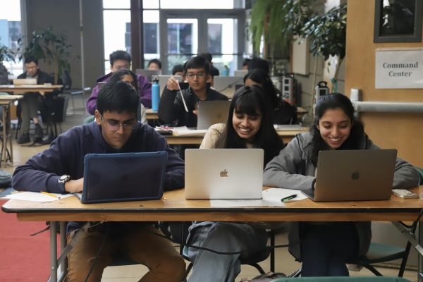 High school coders collaborate on the novice problem set during HPCs Harker Programming Invitation in Nichols Atrium on Mar. 9. Groups of up to three students worked together to solve ten questions in two hours in the novice division.