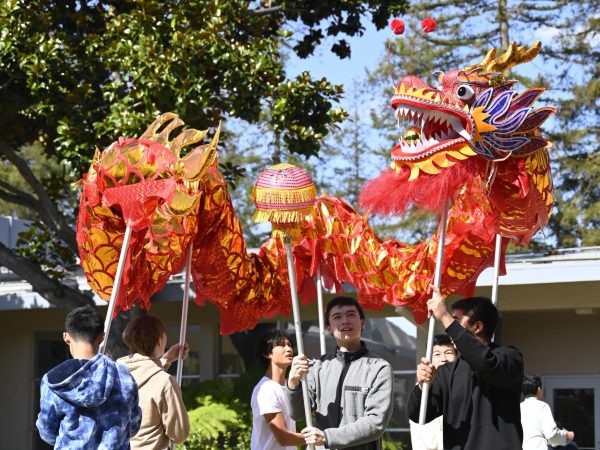 Mandarin students hold poles supporting a dancing dragon in the Quad on Feb. 22. The dragon followed the movement of a spherical pearl which represents wisdom.